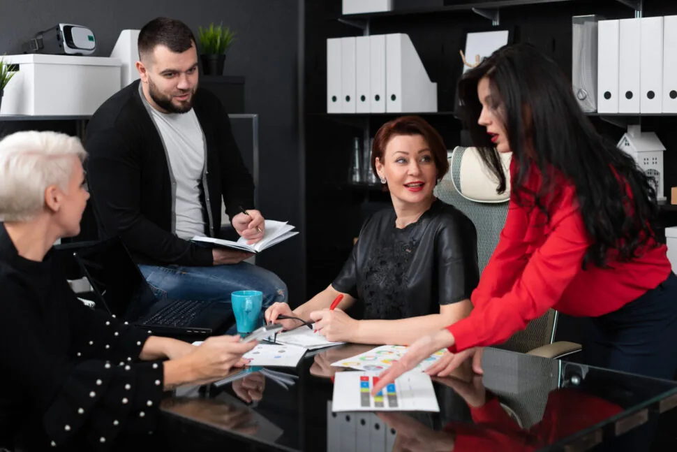A creative team at work around an office desk