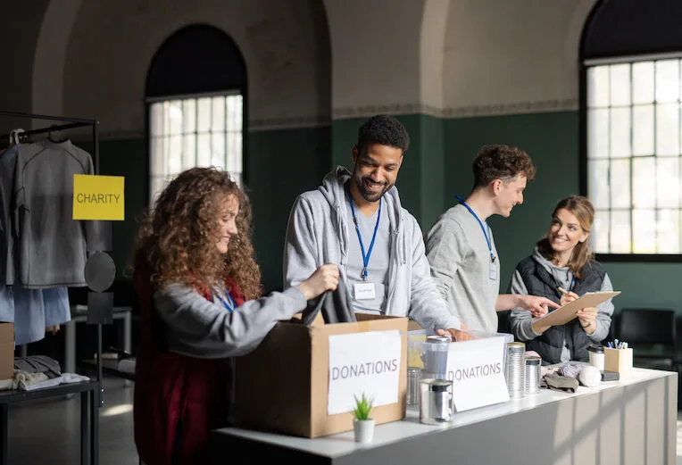Volunteers sorting donations in a warehouse