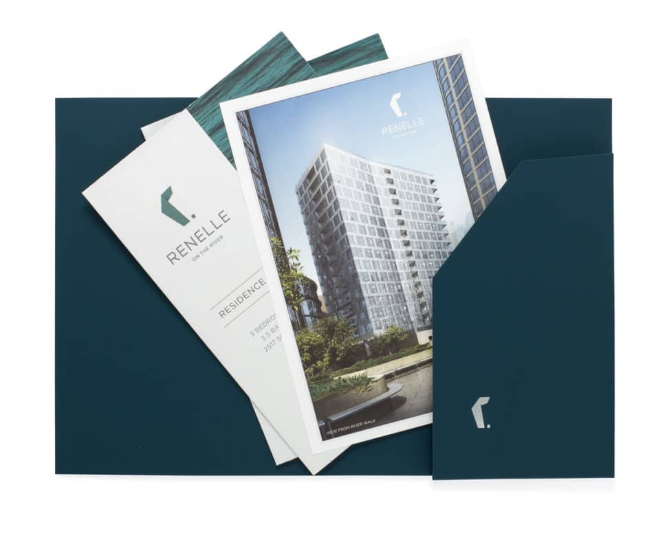 Custom presentation folder for Renelle featuring embossed logo, soft-touch coating, and refined design for real estate branding