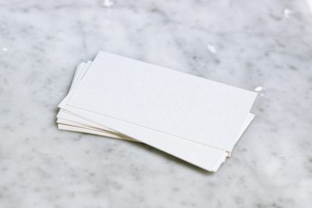 A stack of blank postcard stock
