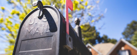 A curbside mailbox with the flag up
