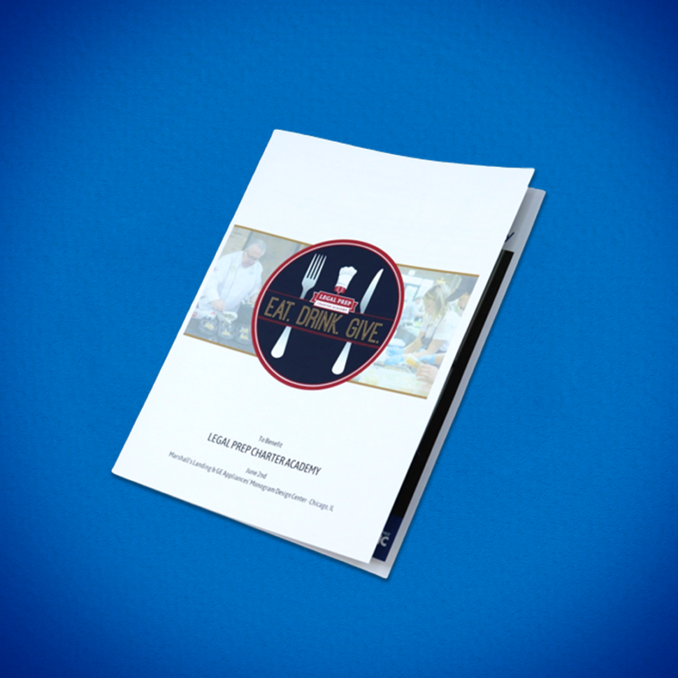 A custom saddle-stitched booklet with a circular badge design on its cover