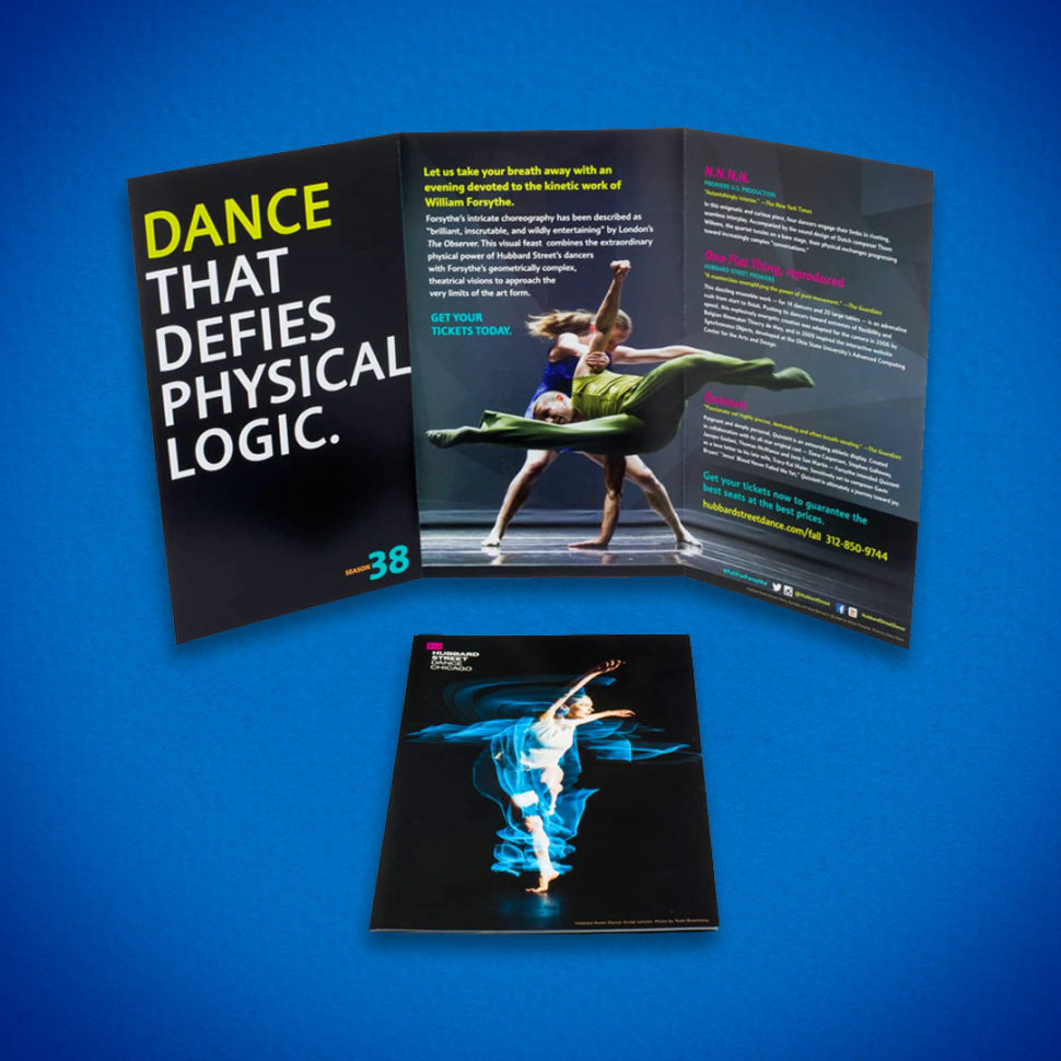 A custom tri-fold brochure standing open beside its printed cover panel