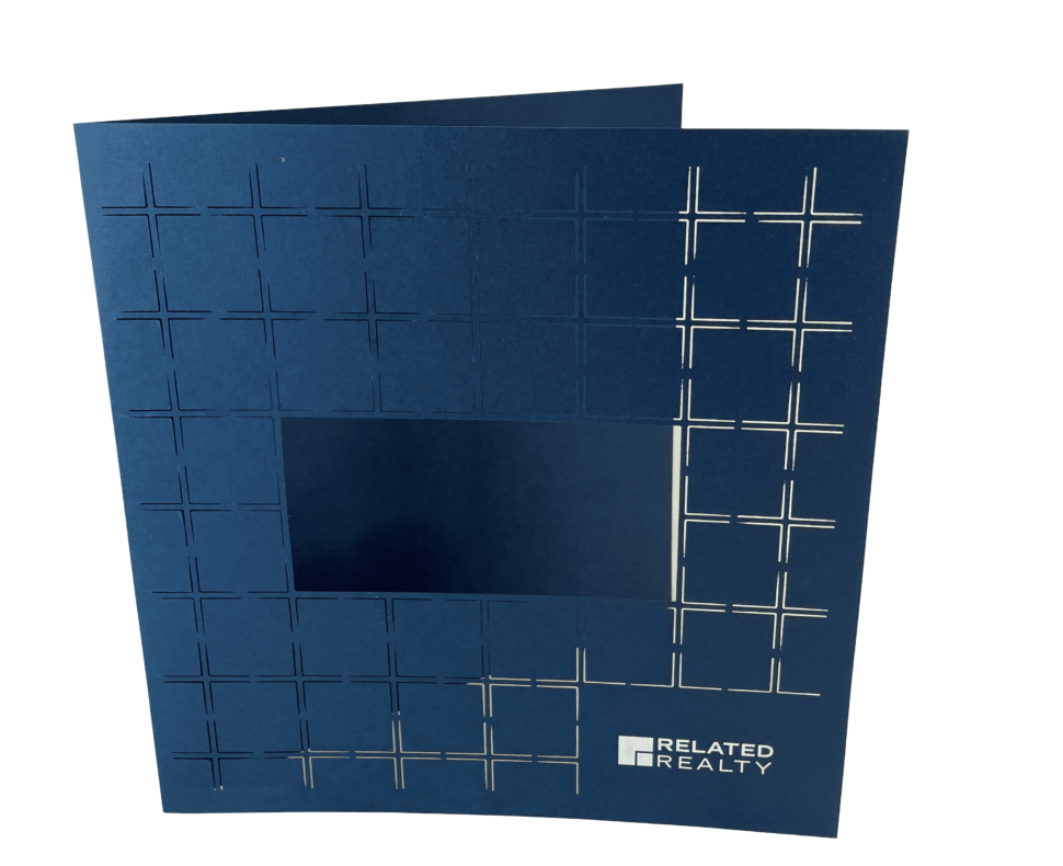 Listing-Brochure-Cover-White-Foil-Stamp-on-Blue-Felt-Cover-with-Laser-Diecut Custom real estate cover for Related Realty used for professional presentation and branded materials