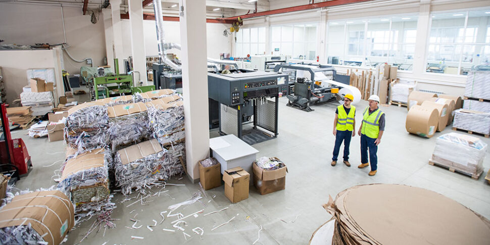 Workers at paper recycling plant