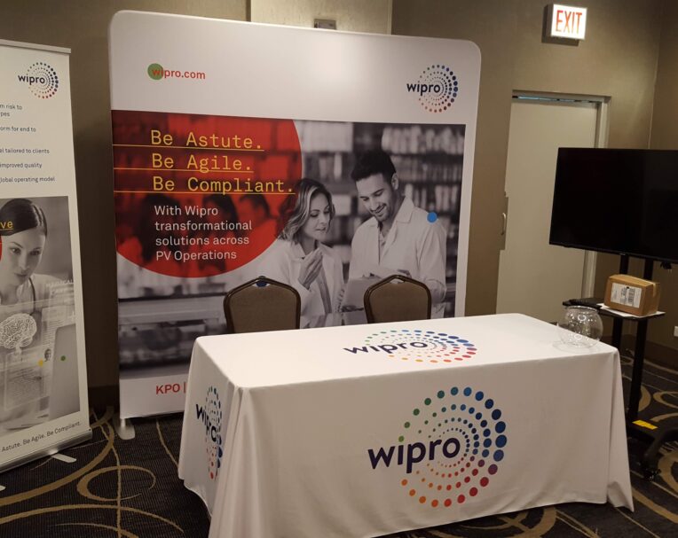 Custom printed event package for Wipro featuring coordinated branded materials for a professional corporate event