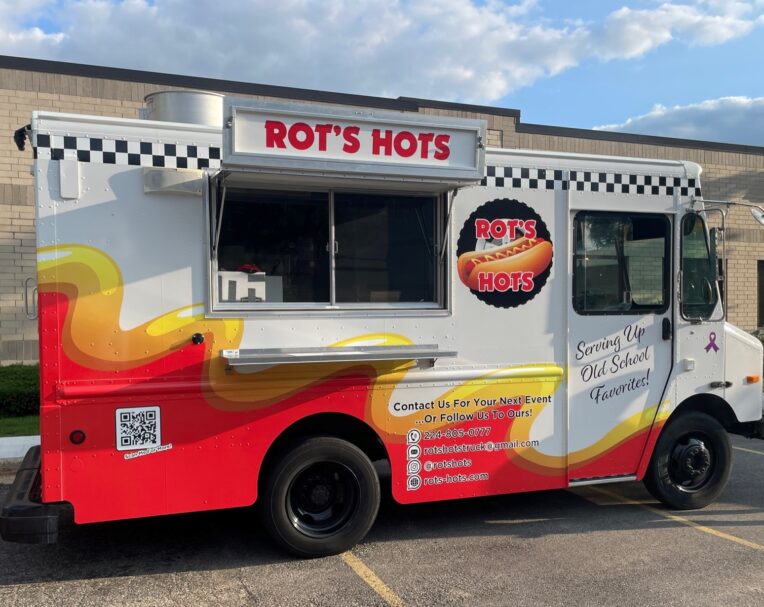 Custom vinyl wrap for Rots Hots food truck featuring bold colors and full-coverage branding for high-impact mobile advertising