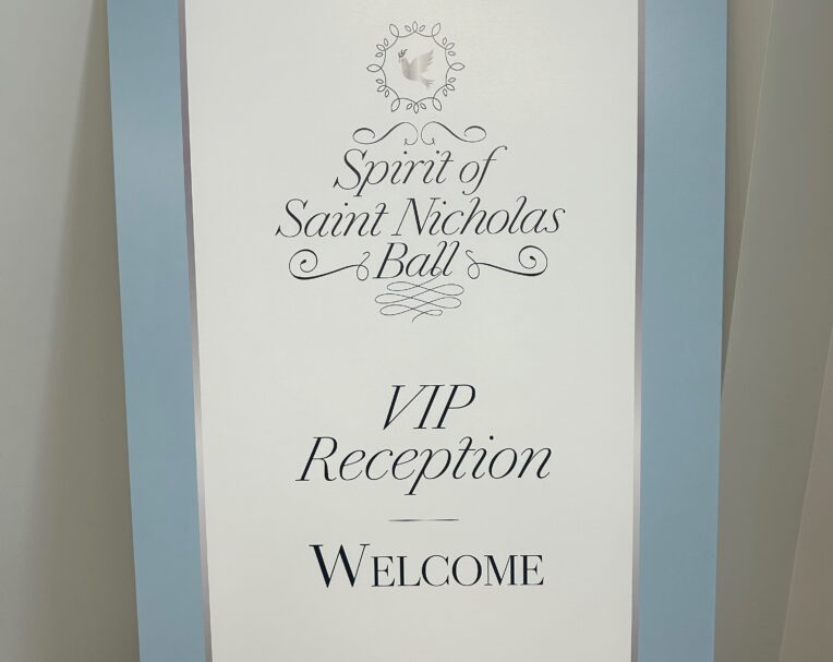 Custom event signage for Catholic Charities Ball used for branding and attendee wayfinding
