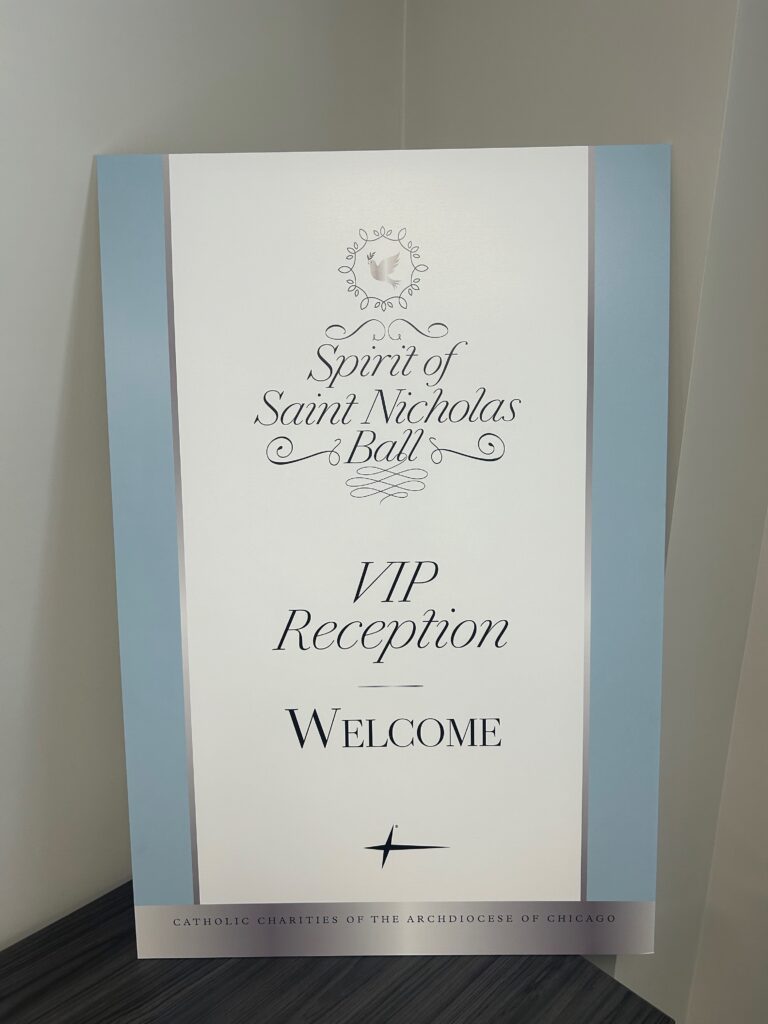 Custom event signage for Catholic Charities Ball used for branding and attendee wayfinding