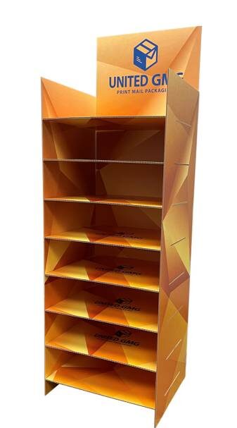 Custom die-cut shelf display for UGMG featuring branded graphics and structural design for events or retail presentation