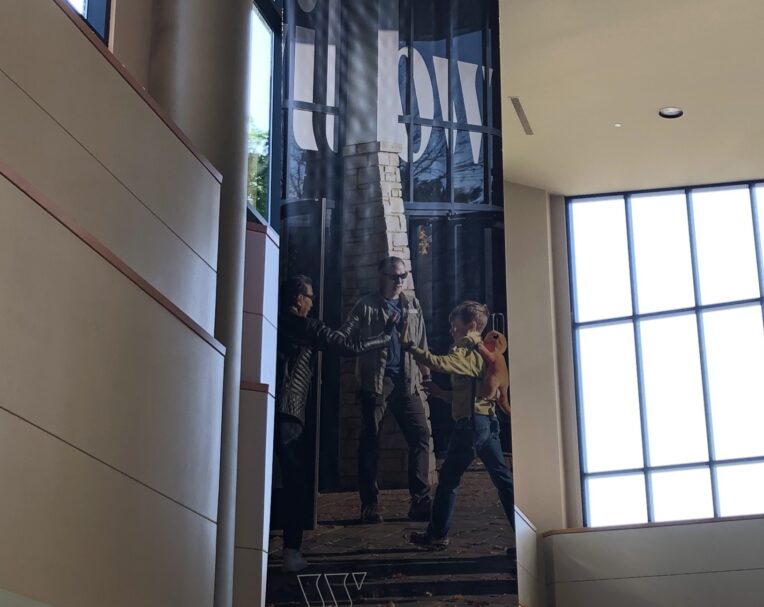 Custom lobby banner for Willow featuring large-format print and welcoming branded design for nonprofit spaces