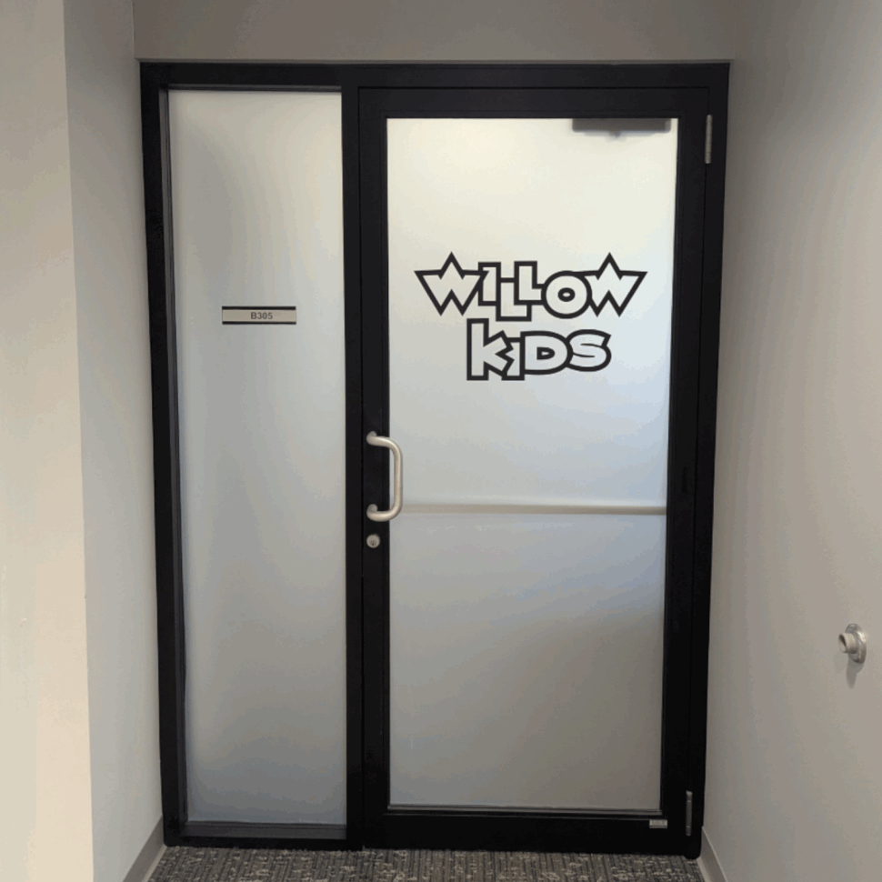 Door graphics for Willow Kids featuring welcoming design for family areas.