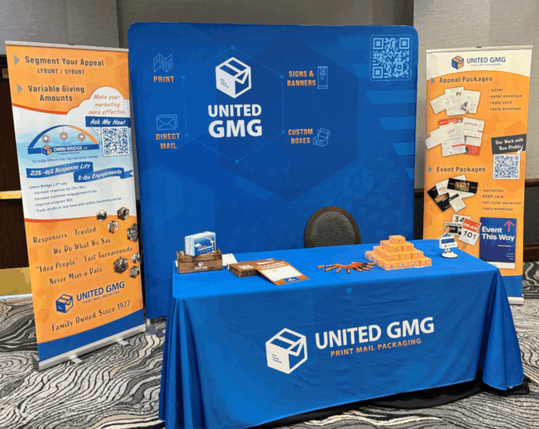 Custom booth signage for United GMG featuring bold branding, large-format graphics, and clean design for trade show displays