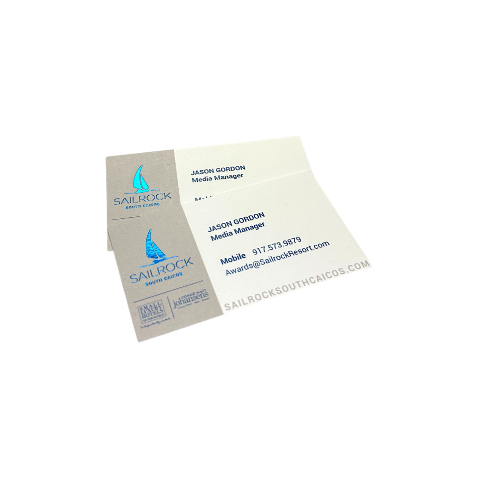 260662 Sailrock Foil Business Card 3 Custom blue foil business cards for Sailrock South Caicos resort showing a foil-stamped sailboat logo on pearl white card stock, front and back view