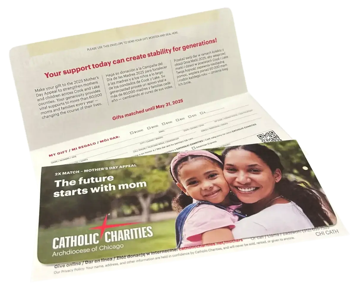 A printed nonprofit appeal with a personalized reply and remittance envelope