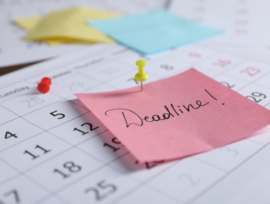 Deadline note pinned to a production calendar