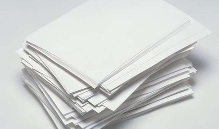 Stack of smooth white text-weight paper sheets